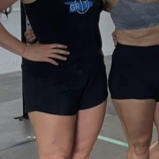 Athlete wearing GRIT Coaching branded tank